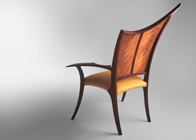 carved upholstered chair in rosewood and leather